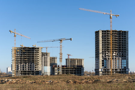Photo of the construction site and building of high buildings and cranes in the city.の写真素材