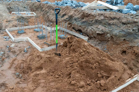 Photo shovel sand foundation construction. High quality photoの写真素材