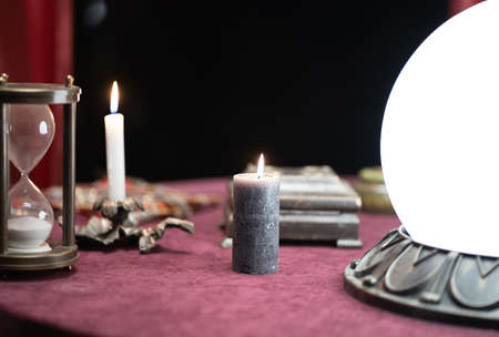 Photo of a table with objects for astrology and fortune-tellingの写真素材
