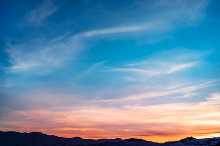 Beautiful panoramic sunset over the mountains silhouette.の写真素材