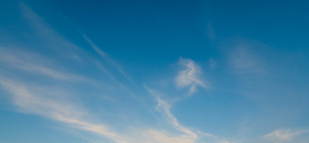 blue sky background with white clouds. Cumulus white clouds in the clear blue sky.の写真素材