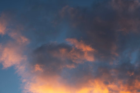 Sunset sky background. Beautiful evening sunset sky with clouds.の写真素材