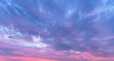 Sunset sky background with tiny clouds. Panoramic view.の写真素材