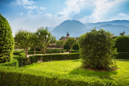 Italian Garden of Buonconsiglio in Trento, Trentino, Italy. It is a beautiful summer day. The mountains are visible in the background.のeditorial素材