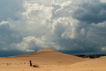 Dunes and white blue cumulus clouds Vietnamの写真素材