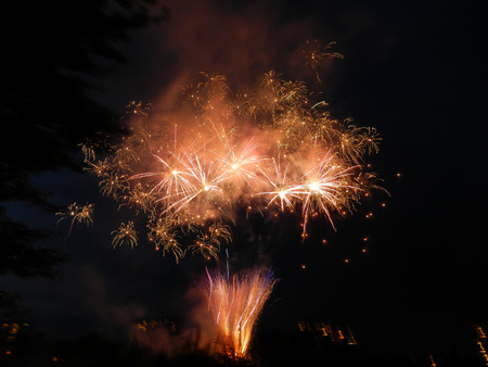 Colored firework at dark nightの写真素材