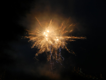 Colored firework at dark nightの写真素材