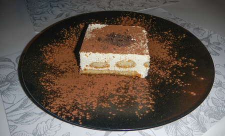 Tasty dessert tiramisu on plate with heartsの写真素材