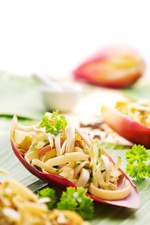 Banana flower salad with cucumber served in banana blossom petalsの写真素材