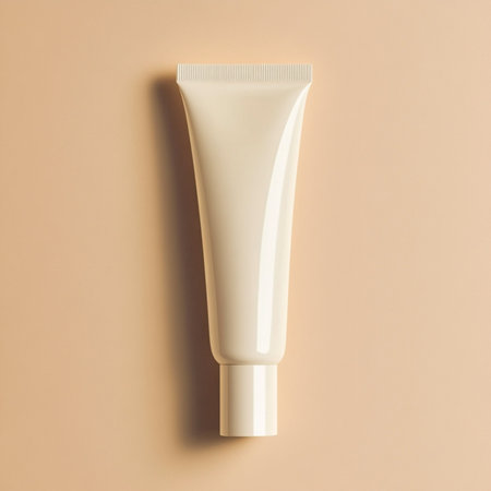 A cosmetic cream tube placed on a soft, delicate background with empty space for text or branding. Ideal for skincare product mockups, packaging presentations, or advertising design. This image represents clean beauty, minimal aesthetics, and a modern promotional styleの写真素材