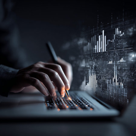 A professional trader using a laptop to analyze financial charts and graphs. Concept of digital...
