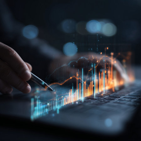 A professional trader using a laptop to analyze financial charts and graphs. Concept of digital...