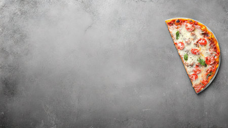 A slice of cheesy lasagna placed on a gray concrete background, highlighting the dish's colors and textures. The empty area around the plate is perfect for captions or descriptions.の素材