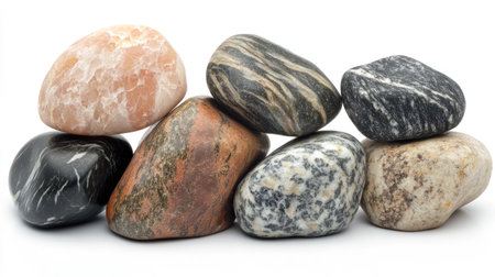 A stack of smooth, rounded stones displaying a variety of colors and textures. Perfect for use in home decor, art projects, or nature-inspired themes.の素材