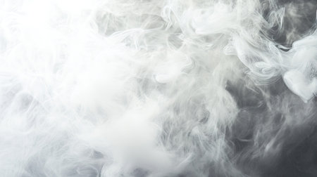 A close-up of white smoke swirling in a studio setting. The clear, open space around the smoke provides a perfect backdrop for text placement.の素材