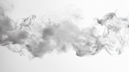 A close-up of white smoke swirling in a studio setting. The clear, open space around the smoke provides a perfect backdrop for text placement.の素材