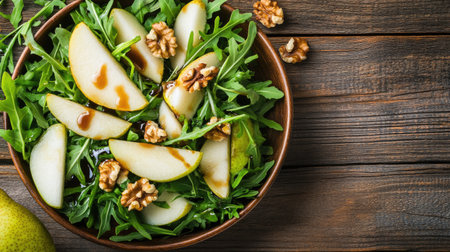 This image showcases a fresh and simple salad featuring crisp pears, crunchy walnuts, and vibrant greens, beautifully arranged in a rustic bowl. Perfect for a healthy lifestyle.の素材