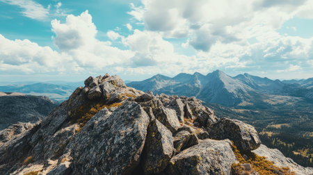 Flat lay of a rocky mountain summit with the vast open sky providing plenty of room for copy space, perfect for nature-themed promotions or designsの素材