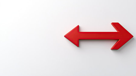 A vibrant red arrow pointing to the left on a clean white background, symbolizing direction or navigation.の素材