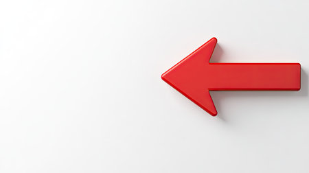 A vibrant red arrow pointing to the left on a clean white background, symbolizing direction or navigation.の素材
