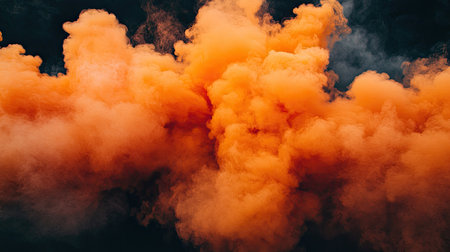 A stunning display of vibrant orange smoke forming an abstract cloud. This image captures the dynamic movement and texture, perfect for creative projects or wallpapers.の素材