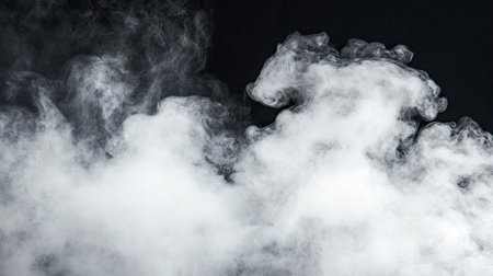 This image features soft white smoke billowing against a dark background, creating an abstract and atmospheric effect perfect for artistic or design projects.の素材