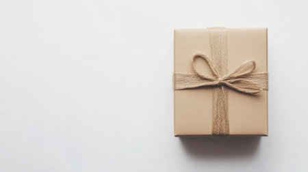 Top-down view of a closed cardboard box isolated on a white background, ideal for minimalist design, packaging, and shipping concept photographyの素材