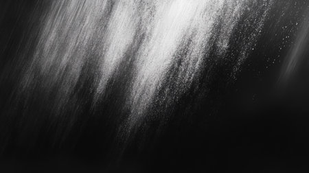 Explore this abstract black and white texture that captures light and shadow in a flowing and dynamic way, perfect for artistic backgrounds or design projects.の素材