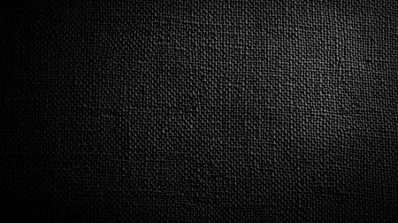A high-quality image of a textured black fabric background suitable for various design purposes. This backdrop offers a sophisticated look for modern projects.の素材