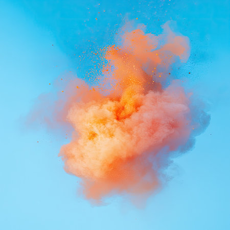 abstract colored dust explosion on a blue backgroundの素材
