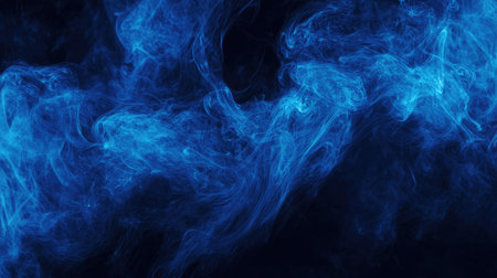 Abstract blue smoke moves on black background. Swirling smoke.の素材
