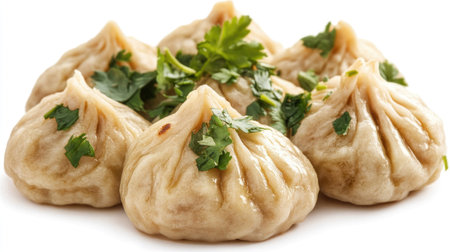 A detailed close-up view of a group of delicious cooked dumplings garnished with fresh herbs, highlighting the culinary art and appealing texture. Perfect for food lovers.の素材
