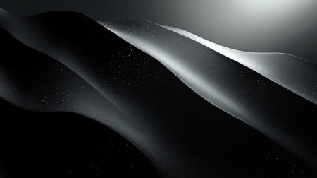 An abstract representation of black sand dunes featuring soft waves and shadows. This image captures the elegance and tranquility of nature's forms.の素材
