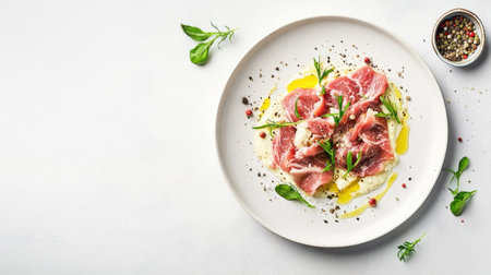 Discover a minimalist flat lay of vitello tonnato, elegantly presented with olive oil and fresh herbs. A perfect visual for culinary inspiration.の素材