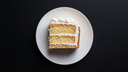 A delightful slice of honey cake topped with cream, presented on a round white plate. Ideal for showcasing delicious desserts in culinary imagery.の素材