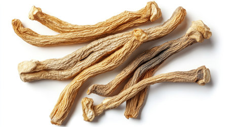 Isolated image of dried ginseng roots on a white background. The top view showcases the twisting forms and natural hues of the traditional medicinal herb.の素材