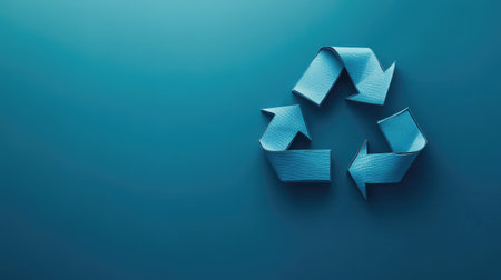 A clean and bold representation of the three arrows forming the recycle symbol against a solid background, emphasizing sustainability with plenty of copy space for your message.の素材