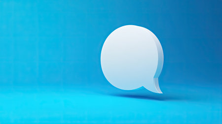 Abstract 3D white chat bubble on a vivid blue backdrop, perfect for illustrating communication, online chat, or message exchange.の素材