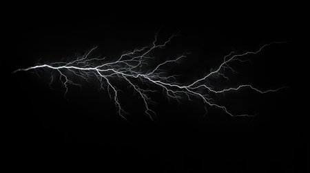 Massive lightning bolt with intricate branches isolated on a pitch-black background, emphasizing the dramatic and powerful aspects of a thunderstorm.の素材