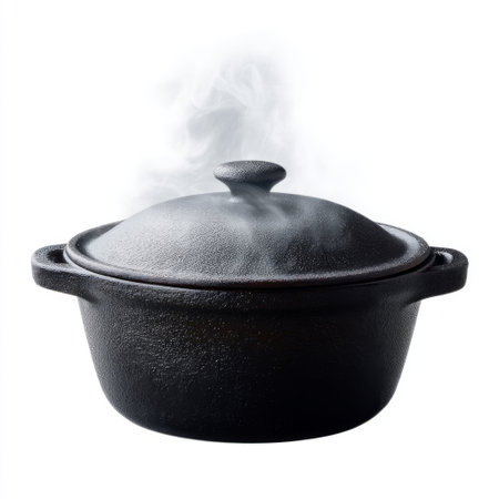 A classic cast iron pot with a lid, emitting steam, ideal for showcasing culinary traditions in the kitchen. Perfect for cooking enthusiasts and chefs.の素材