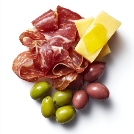 A colorful arrangement featuring assorted meats, cheeses, and olives ideal for creating a vibrant charcuterie board or elegant appetizer platter.の素材