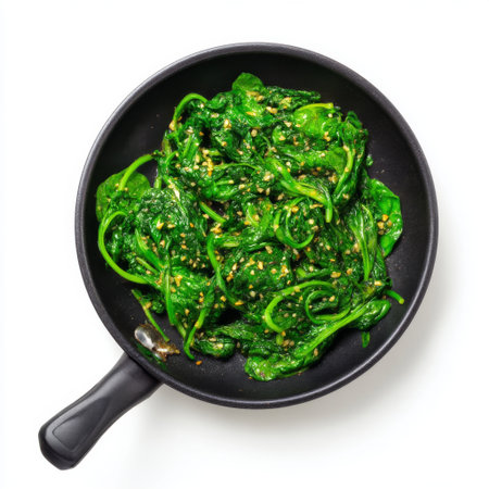 A vibrant pan filled with freshly sautの素材