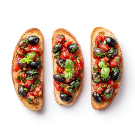 This vibrant image showcases fresh bruschetta topped with tomatoes, olives, and basil on crispy bread, perfect for appetizers or casual dining.の素材