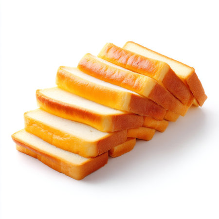 A vibrant display of freshly sliced soft bread loaves arranged neatly on a clean white background, ideal for culinary themes and bakery promotions.の素材