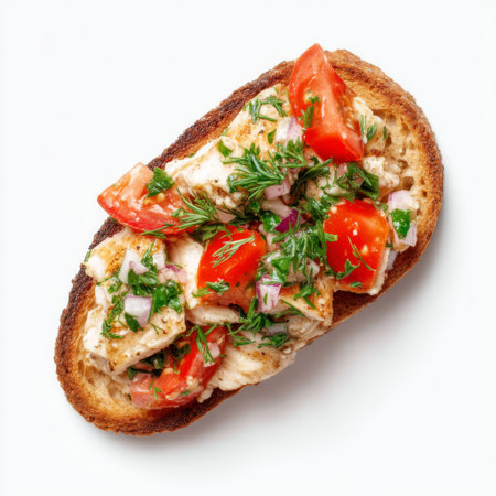 A delicious open-faced grilled chicken toast topped with fresh tomatoes, onions, and a sprinkle of herbs, perfect for any meal or snack.の素材