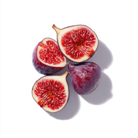 A visually appealing arrangement of fresh figs, both whole and sliced. The rich color and intricate texture make this image ideal for culinary and healthy lifestyle themes.の素材