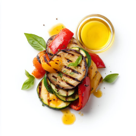This image showcases a delightful arrangement of grilled zucchini, bell peppers, and squash garnished with fresh basil and a drizzle of olive oil.の素材