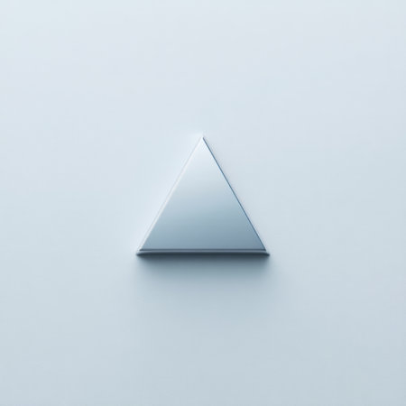 A minimalist geometric triangle reflects light against a soft background, showcasing the beauty of simplicity and modern design elements in art.の素材