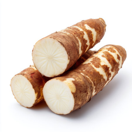 A visually appealing image of freshly cut taro root slices showcasing their creamy interior and unique textures against a clean white background.の素材