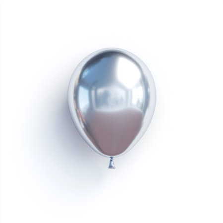 A striking shiny metallic silver balloon floats gently against a clean white background, perfect for festive occasions, parties, and celebratory events.の素材